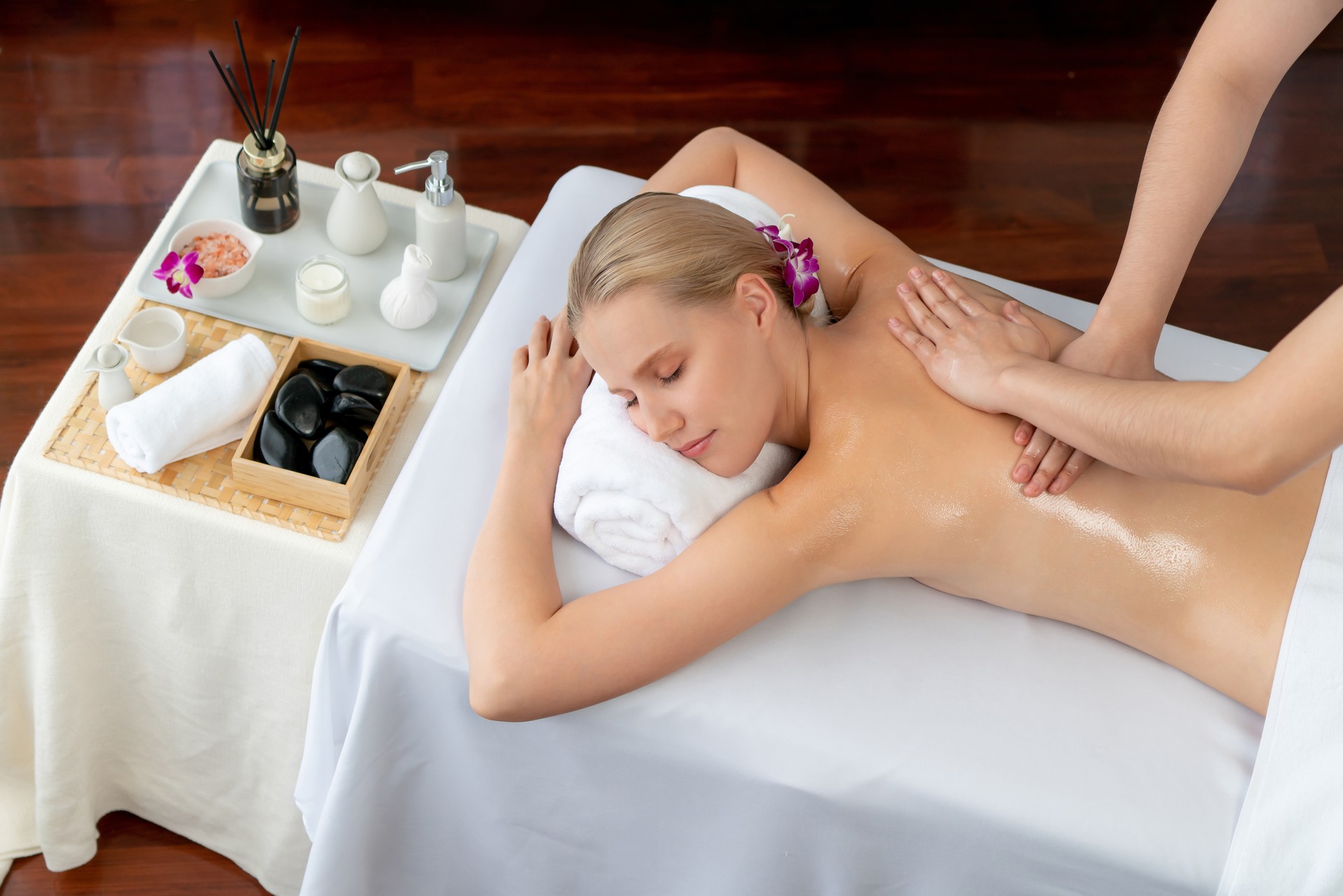 Caucasian woman customer enjoying relaxing anti-stress massage. Quiescent